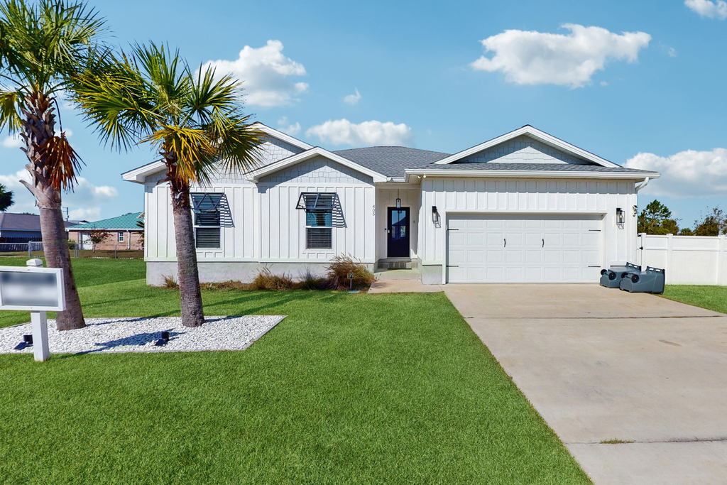 Dog friendly, coastal retreat with fenced yard, private pool, golf cart and cove