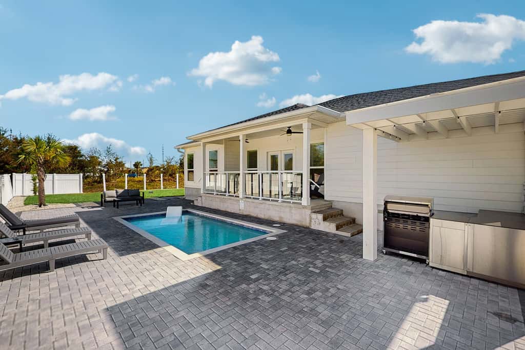 Dog friendly, coastal retreat with fenced yard, private pool, golf cart and cove