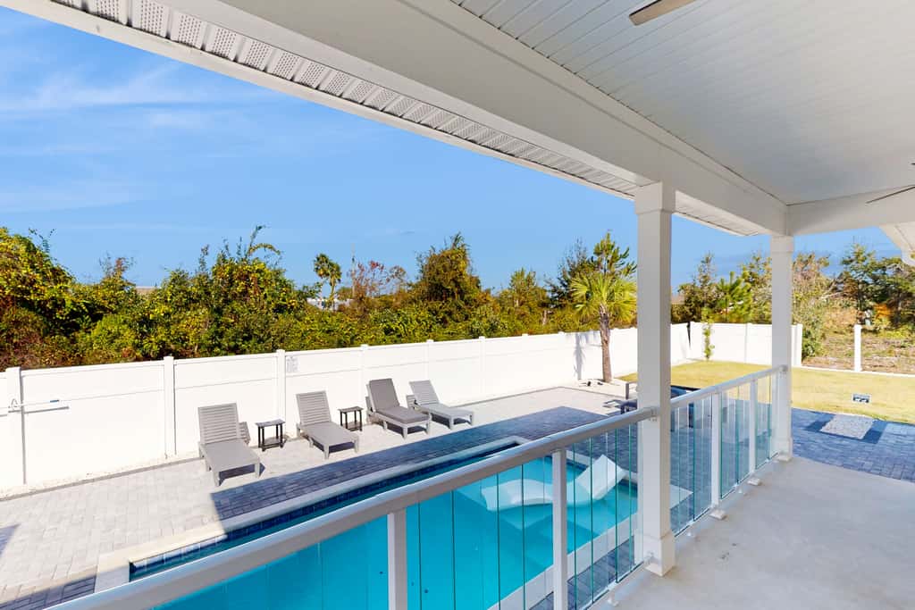Dog friendly, coastal retreat with fenced yard, private pool, golf cart and cove