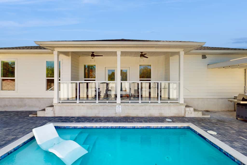 Dog friendly, coastal retreat with fenced yard, private pool, golf cart and cove