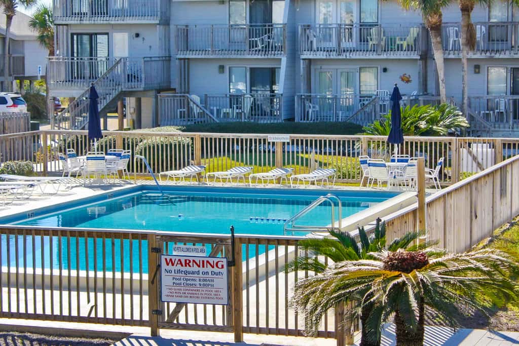 Dog-friendly beachfront townhouse with community pool, washer&dryer, central AC