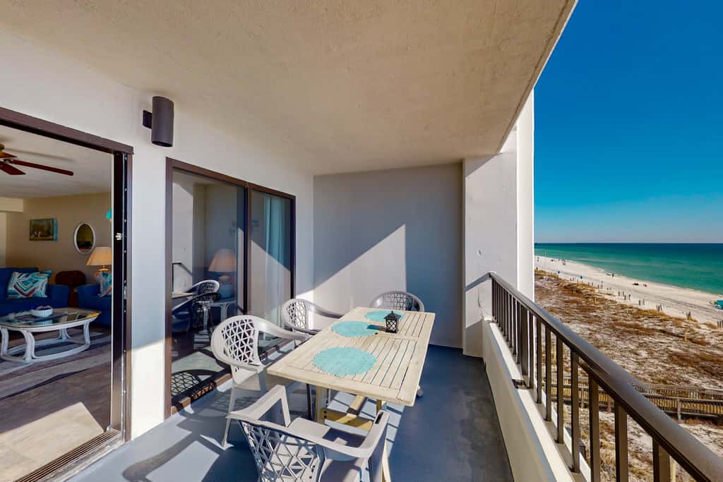 Gulf view & beachfront condo with balcony, pool, tennis, & gym