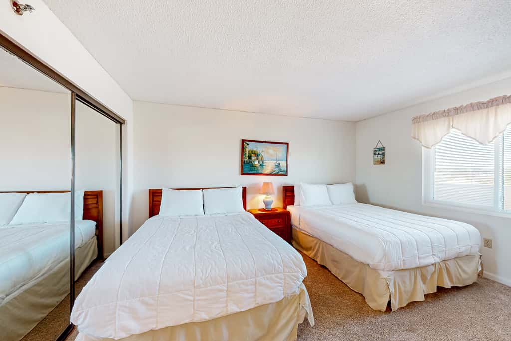 Gulf view & beachfront condo with balcony, pool, tennis, & gym