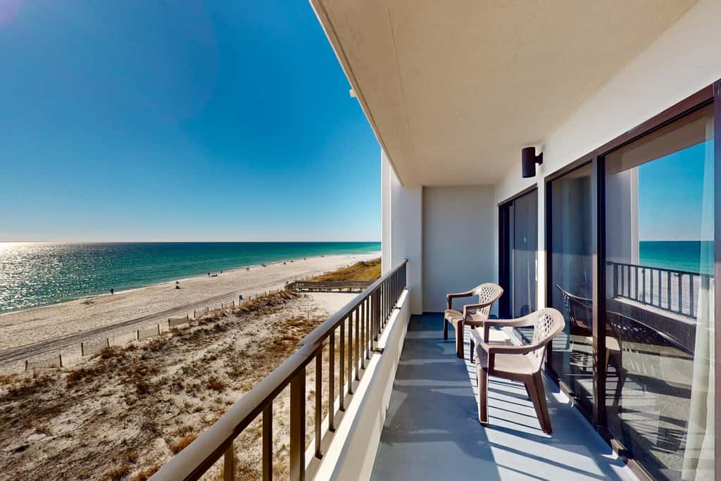 Gulf view & beachfront condo with balcony, pool, tennis, & gym