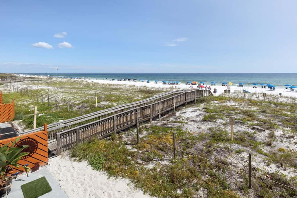 Gulf view & beachfront condo with balcony, pool, tennis, & gym