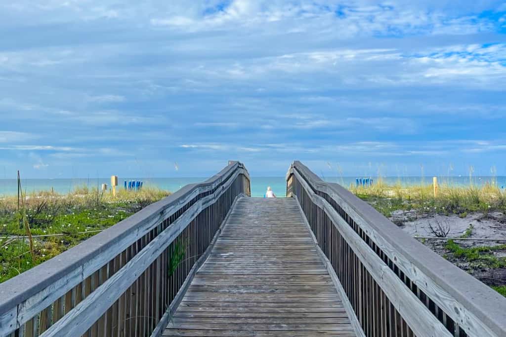 Gulf view & beachfront condo with balcony, pool, tennis, & gym