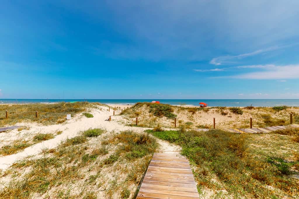 Dog-friendly beachfront home with private boardwalk, park style grill, deck, beach view