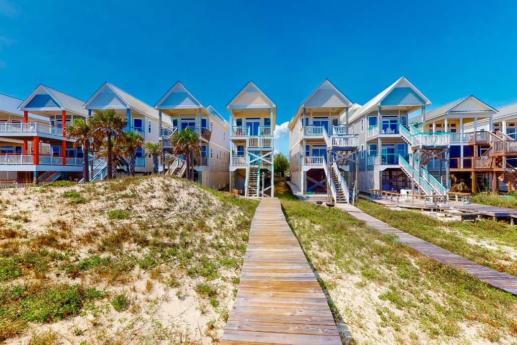 Dog-friendly beachfront home with private boardwalk, park style grill, deck, beach view