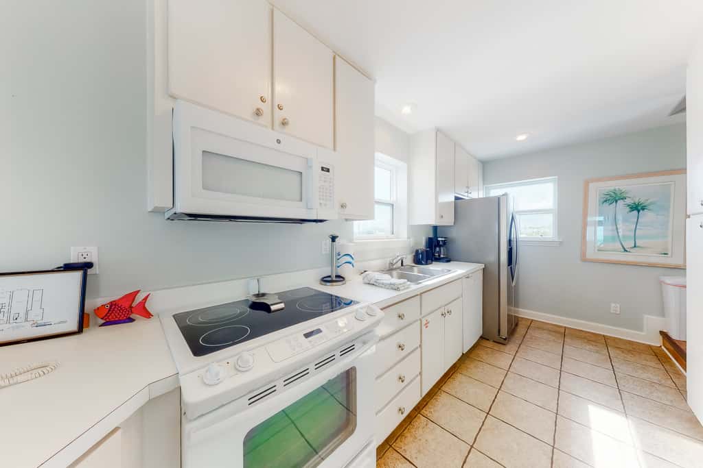 Dog-friendly beachfront home with private boardwalk, park style grill, deck, beach view