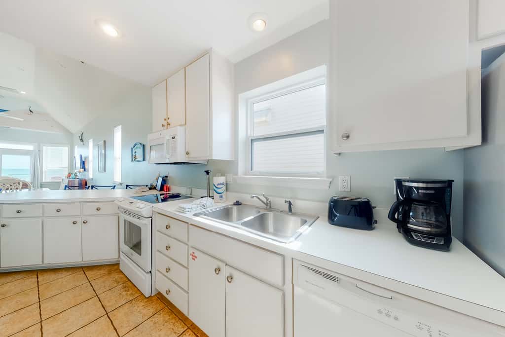Dog-friendly beachfront home with private boardwalk, park style grill, deck, beach view