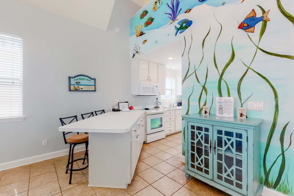 Dog-friendly beachfront home with private boardwalk, park style grill, deck, beach view