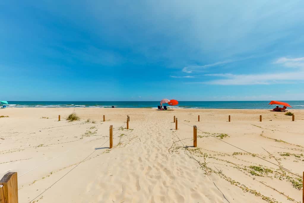 Dog-friendly beachfront home with private boardwalk, park style grill, deck, beach view
