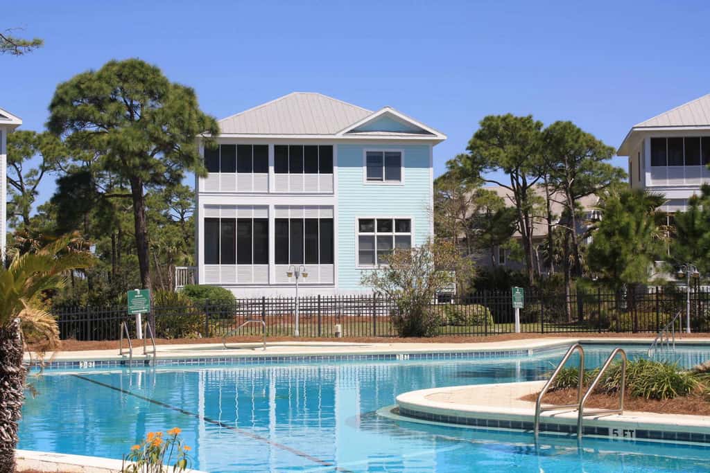 Spacious dog-friendly home with elevator, screened decks, on-site pool, & gym