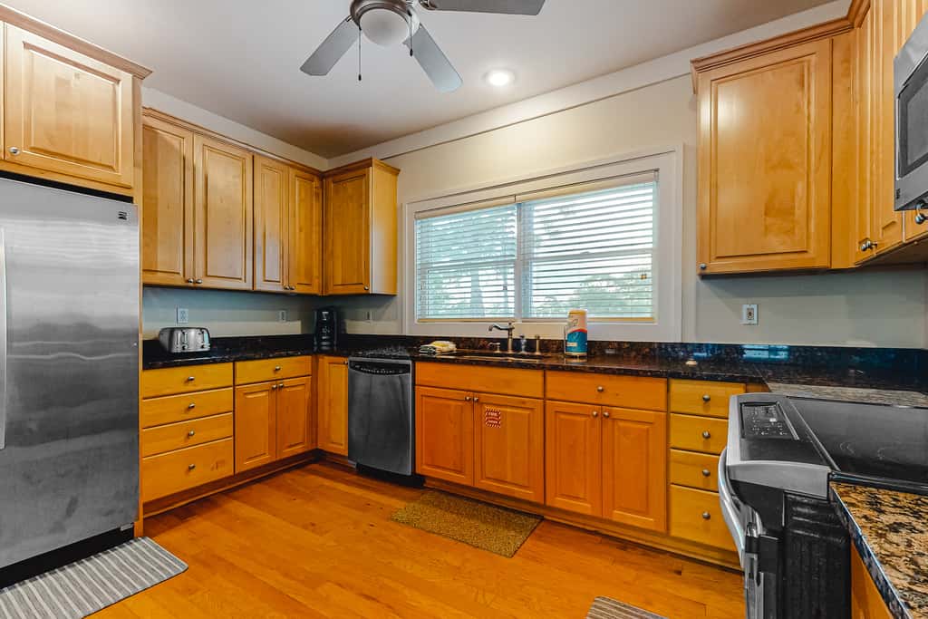 Spacious dog-friendly home with elevator, screened decks, on-site pool, & gym