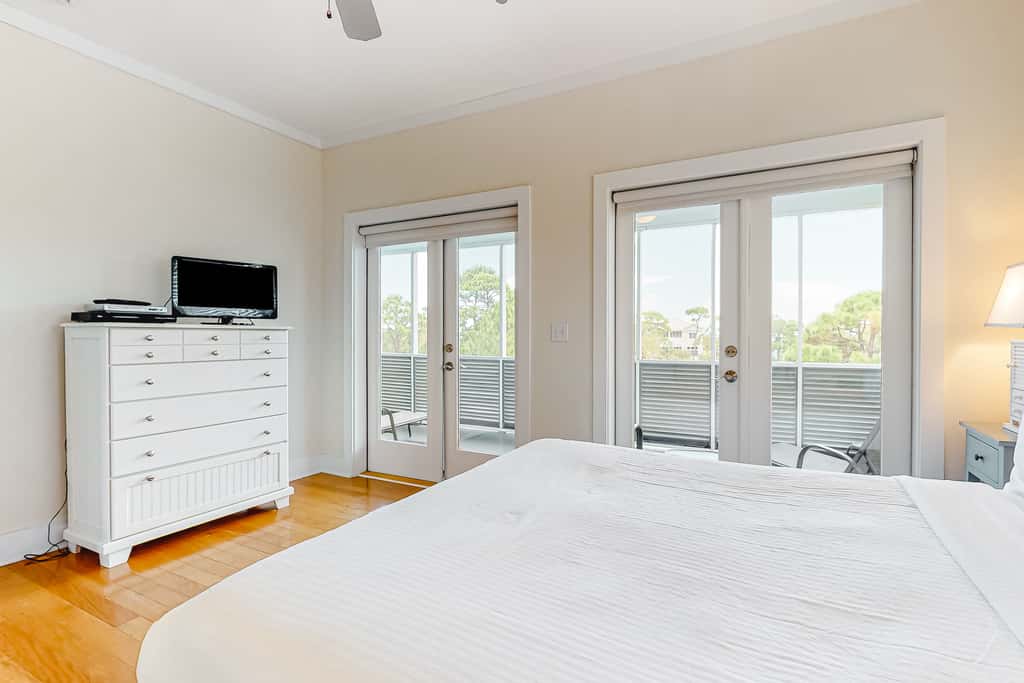 Spacious dog-friendly home with elevator, screened decks, on-site pool, & gym