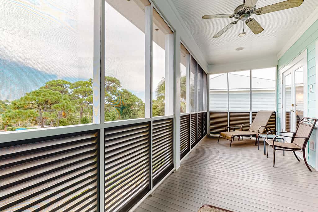 Spacious dog-friendly home with elevator, screened decks, on-site pool, & gym