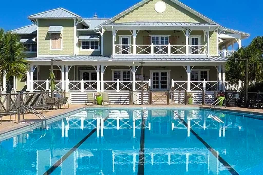Spacious dog-friendly home with elevator, screened decks, on-site pool, & gym