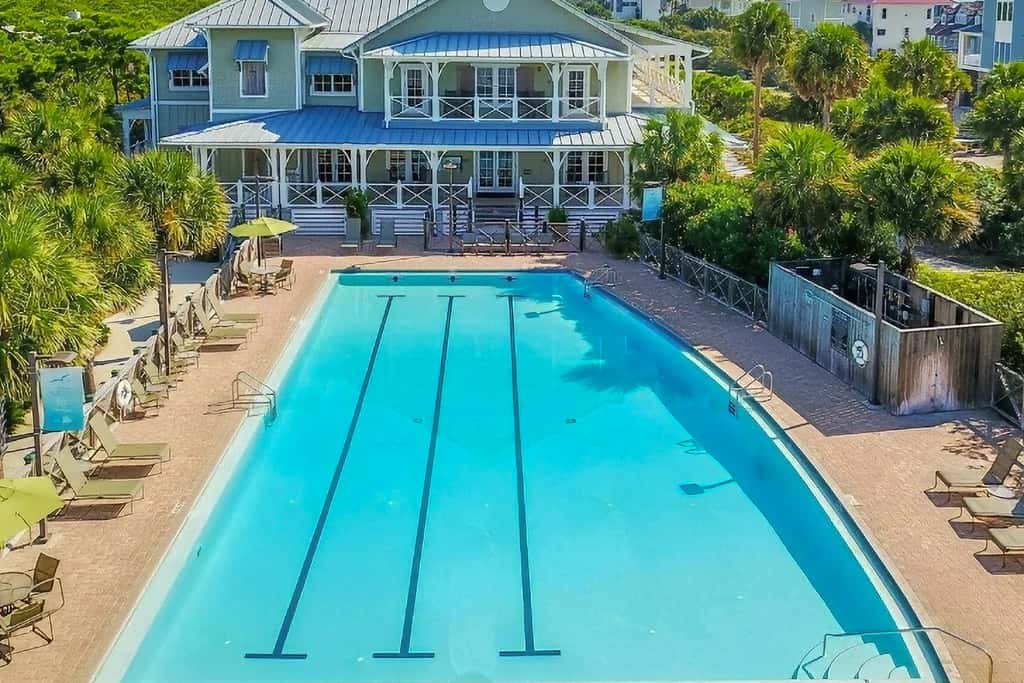 Spacious dog-friendly home with elevator, screened decks, on-site pool, & gym