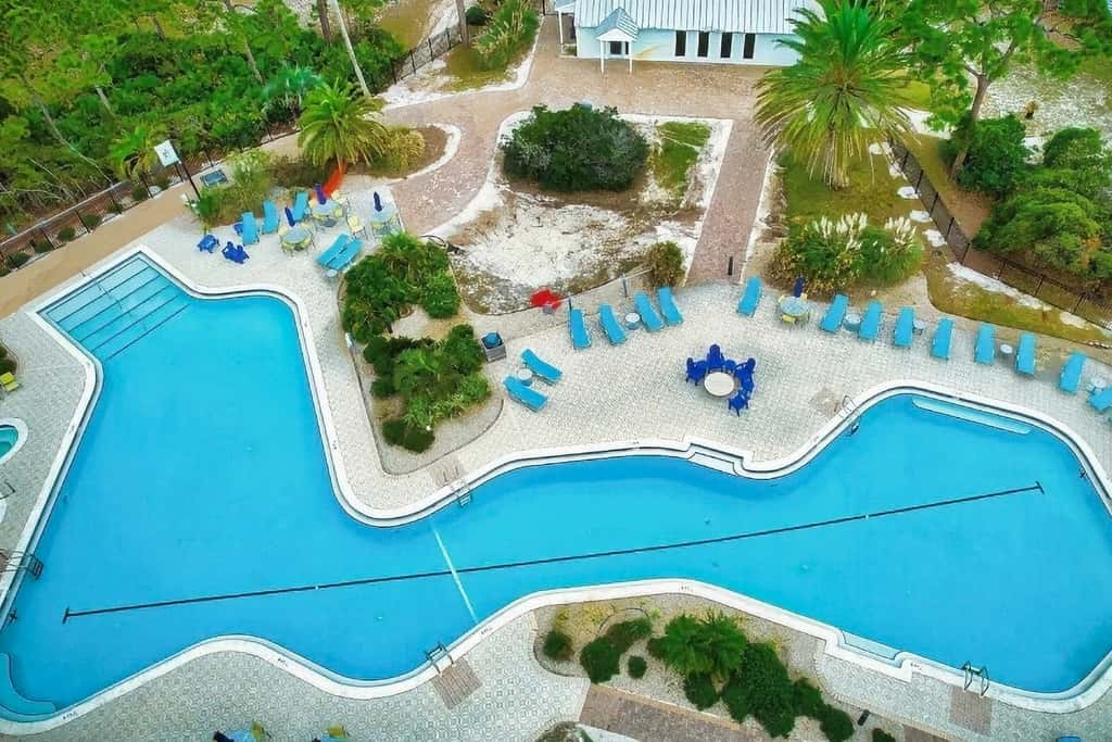 Spacious dog-friendly home with elevator, screened decks, on-site pool, & gym