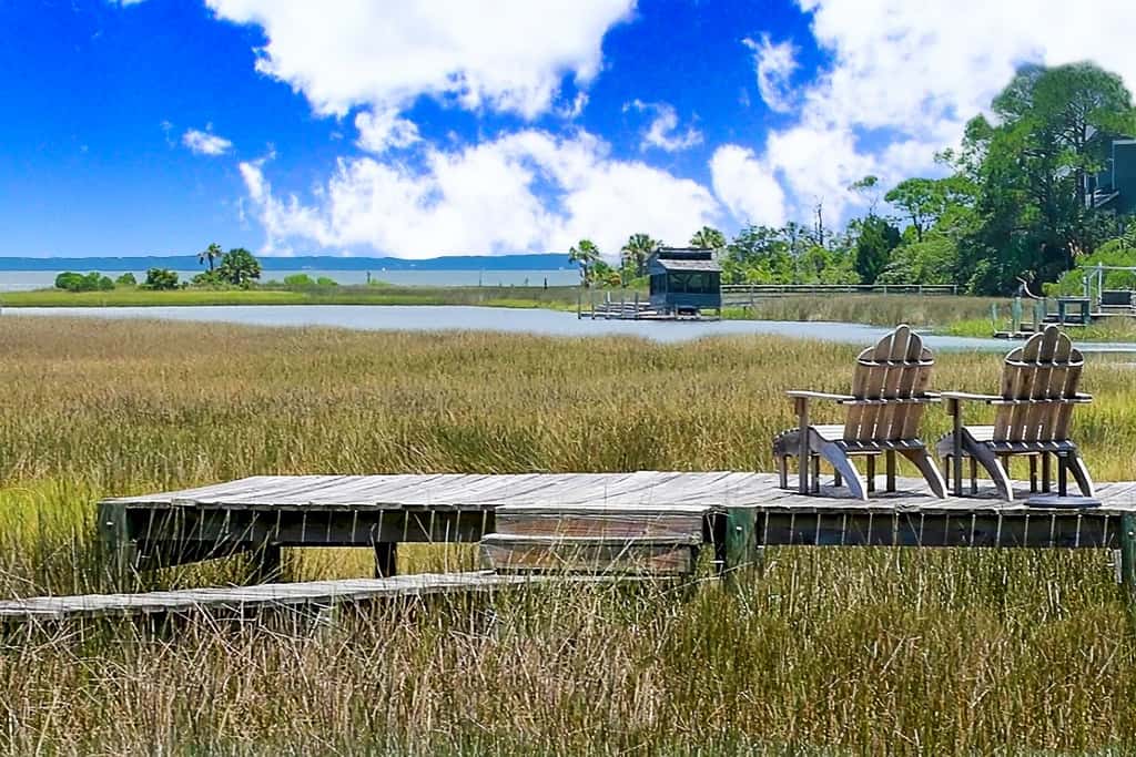 Spacious dog-friendly home with elevator, screened decks, on-site pool, & gym