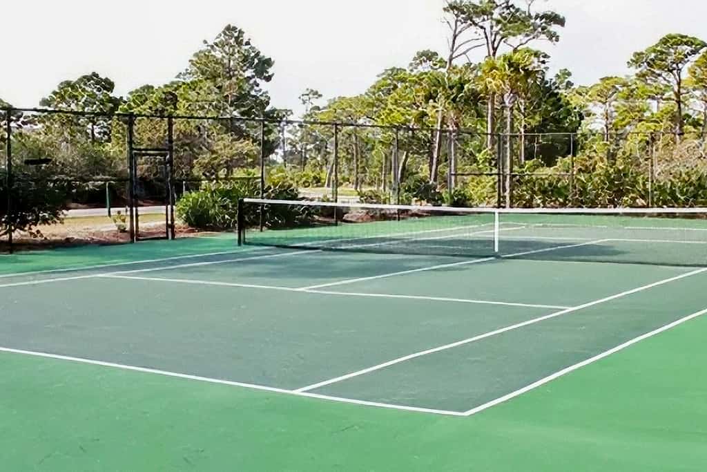 Spacious dog-friendly home with elevator, screened decks, on-site pool, & gym