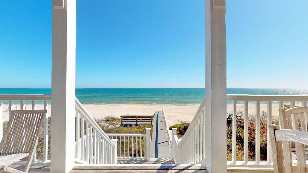 Upscale beachfront home with private hot tub, grill, on-site pools, gym, dogs OK