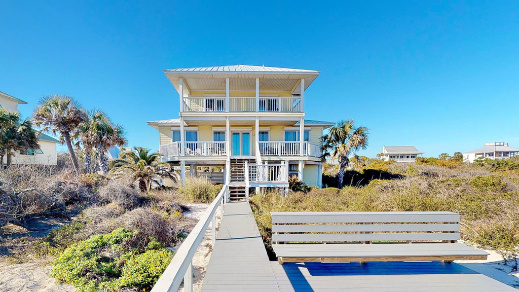 Upscale beachfront home with private hot tub, grill, on-site pools, gym, dogs OK
