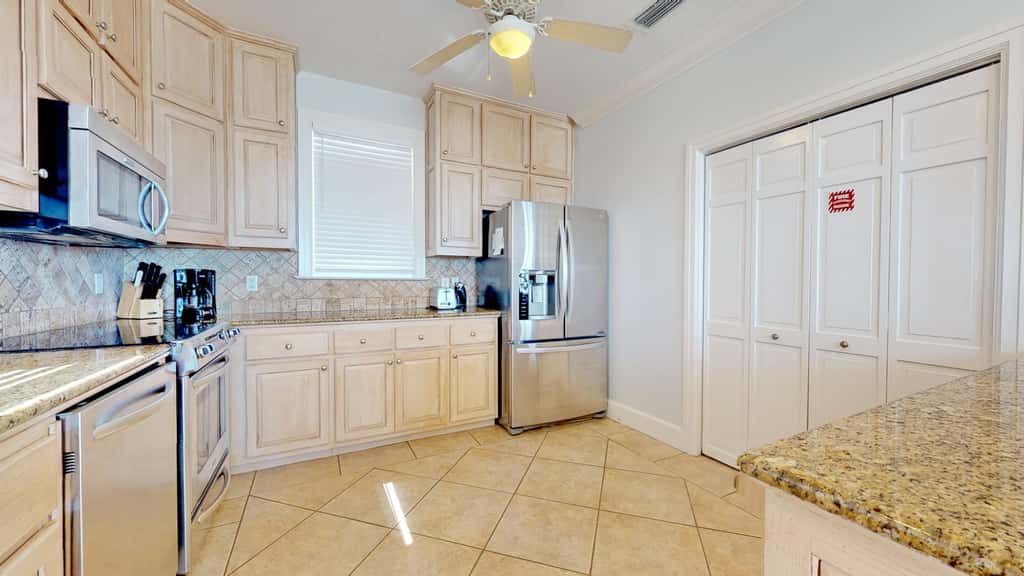 Upscale beachfront home with private hot tub, grill, on-site pools, gym, dogs OK