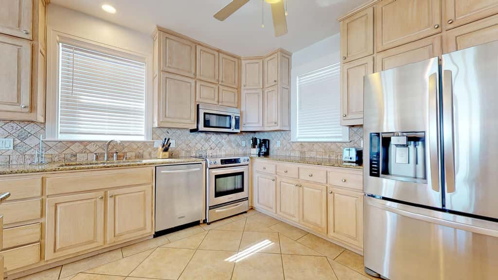 Upscale beachfront home with private hot tub, grill, on-site pools, gym, dogs OK