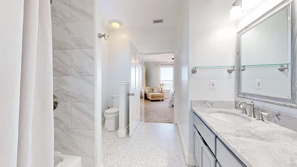 Upscale beachfront home with private hot tub, grill, on-site pools, gym, dogs OK
