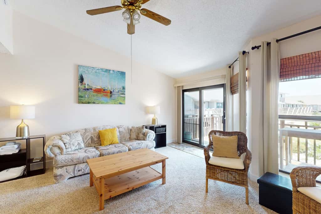 Comfortable townhome steps from beach with pool access, balcony, & WD
