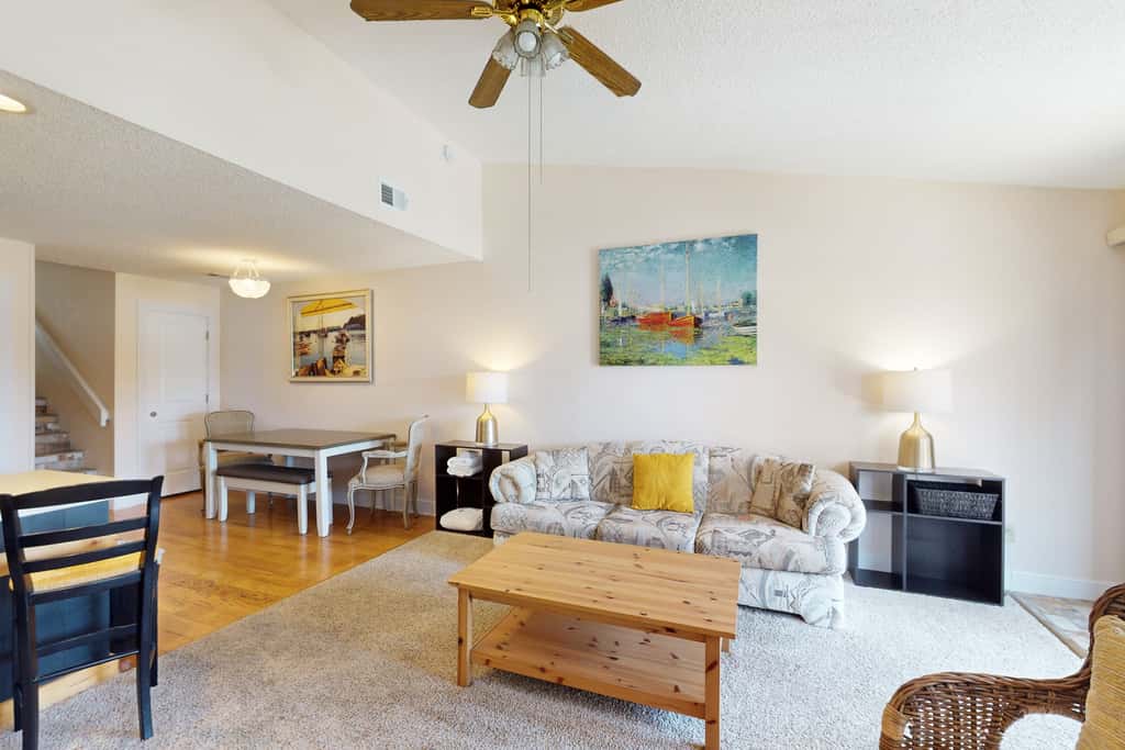 Comfortable townhome steps from beach with pool access, balcony, & WD