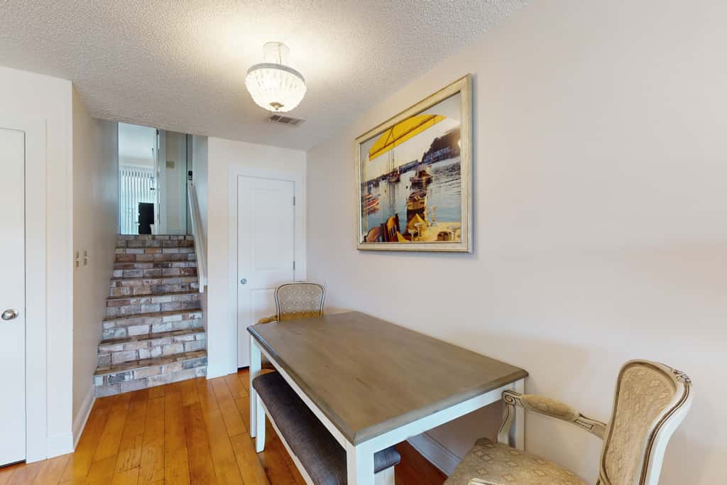 Comfortable townhome steps from beach with pool access, balcony, & WD