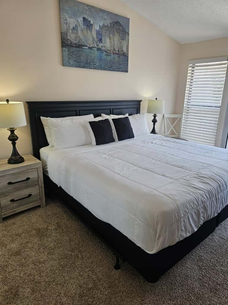 Comfortable townhome steps from beach with pool access, balcony, & WD