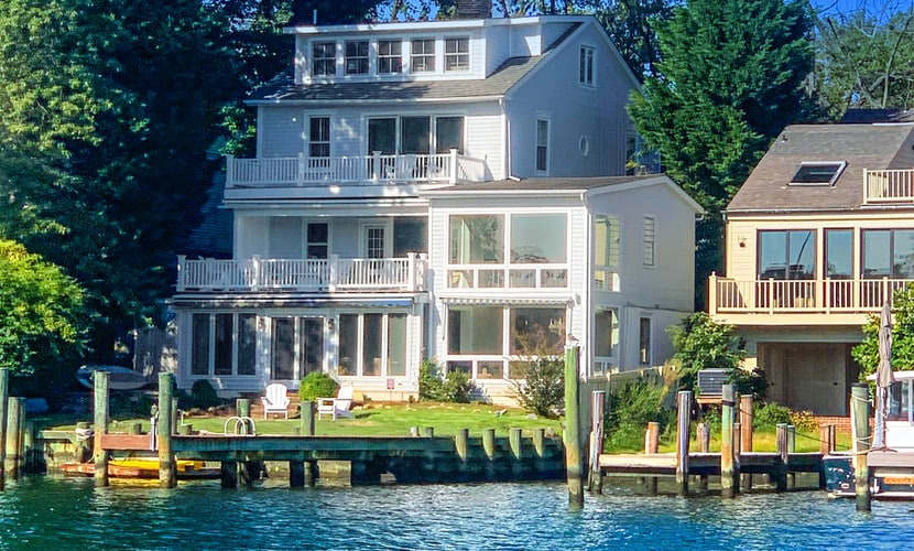 Dog-friendly riverfront home with dock, 2 balconies, waterside patio, & grill