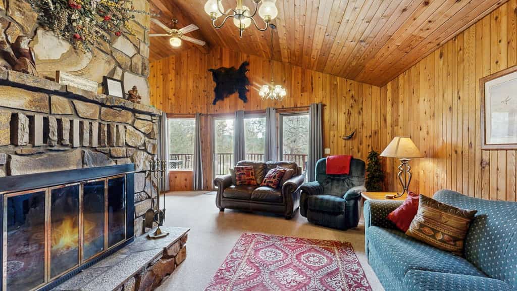 A true mountain cabin tucked in the trees just 3 miles from downtown Cascade and near Lake Cascade. With two separate living rooms, a wraparound deck, and warm wood interiors throughout, this home offers a comfortable and classic mountain stay with space to gather and unwind.