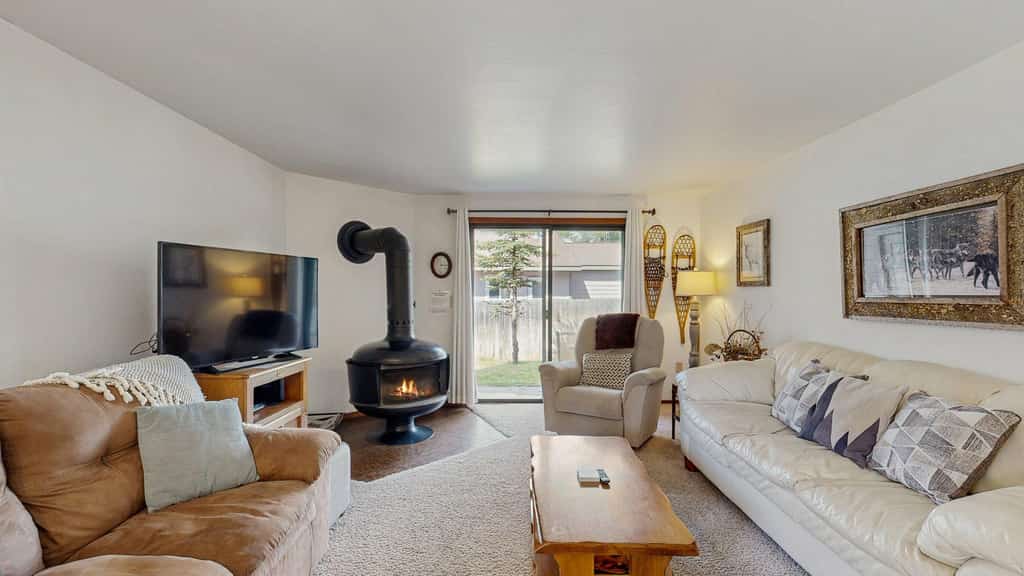 Comfortable and conveniently located, this ground-floor McCall condo is just a short stroll from Payette Lake and downtown McCall. Enjoy a cozy wood-burning fireplace, private deck with grill, seasonal community pool, and a bright open layout with plenty of natural light, making it an easy home base for exploring McCall year-round.
