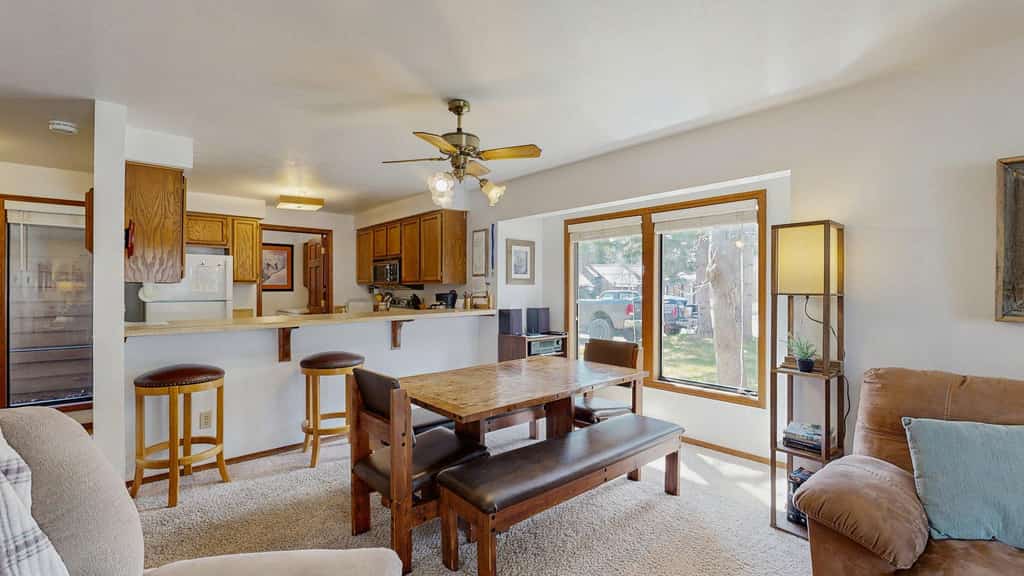 Comfortable and conveniently located, this ground-floor McCall condo is just a short stroll from Payette Lake and downtown McCall. Enjoy a cozy wood-burning fireplace, private deck with grill, seasonal community pool, and a bright open layout with plenty of natural light, making it an easy home base for exploring McCall year-round.