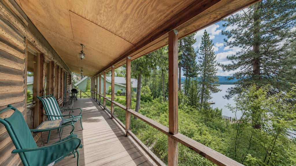A classic lakefront cabin with floor-to-ceiling views of Payette Lake, private beach access, and a nostalgic McCall feel throughout. This cozy retreat features multiple sleeping spaces upstairs, a covered deck overlooking the lake, and a private dock with seating by the water. Wood-paneled interiors and vintage cabin charm create the quintessential McCall getaway experience.