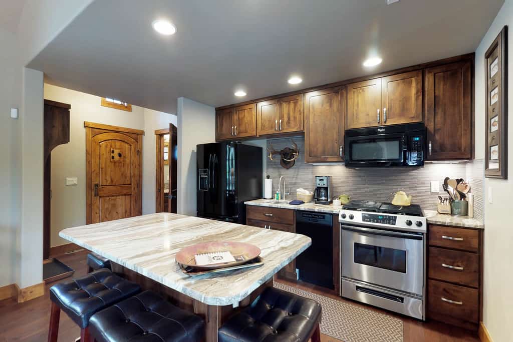 Located within Tamarack Resort, this ski-in/ski-out cottage offers a quiet mountain setting with direct access to the slopes. The layout includes a main-level king suite and an additional bedroom upstairs, making it a great option for couples or small groups. After a day outside, enjoy time on the patio or gather around the fire pit under the open sky.