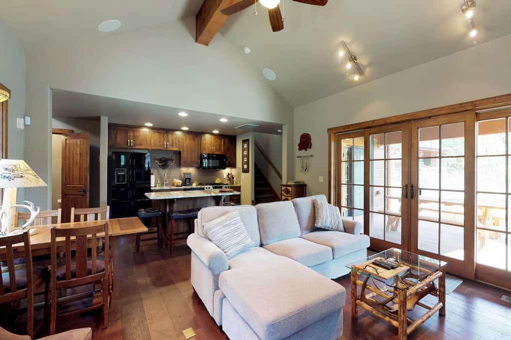 Located within Tamarack Resort, this ski-in/ski-out cottage offers a quiet mountain setting with direct access to the slopes. The layout includes a main-level king suite and an additional bedroom upstairs, making it a great option for couples or small groups. After a day outside, enjoy time on the patio or gather around the fire pit under the open sky.
