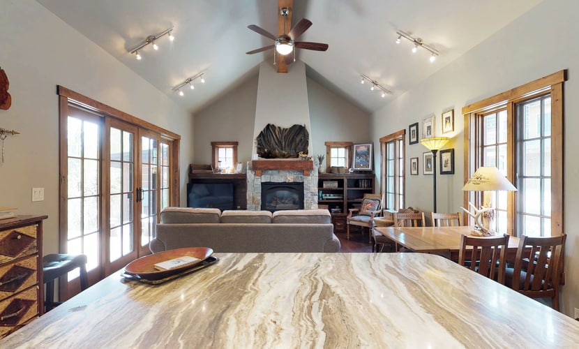 Located within Tamarack Resort, this ski-in/ski-out cottage offers a quiet mountain setting with direct access to the slopes. The layout includes a main-level king suite and an additional bedroom upstairs, making it a great option for couples or small groups. After a day outside, enjoy time on the patio or gather around the fire pit under the open sky.