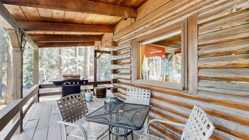 A cozy rustic log cabin less than half a mile from Payette Lake with a covered wraparound deck, vaulted ceilings, and wooded surroundings. Featuring flexible sleeping spaces, two covered outdoor areas, and classic mountain cabin charm, this pet-friendly retreat offers easy access to downtown McCall, lake days, and year-round outdoor adventure.