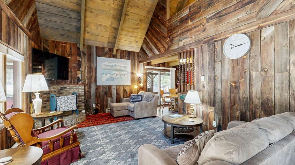 A cozy rustic log cabin less than half a mile from Payette Lake with a covered wraparound deck, vaulted ceilings, and wooded surroundings. Featuring flexible sleeping spaces, two covered outdoor areas, and classic mountain cabin charm, this pet-friendly retreat offers easy access to downtown McCall, lake days, and year-round outdoor adventure.