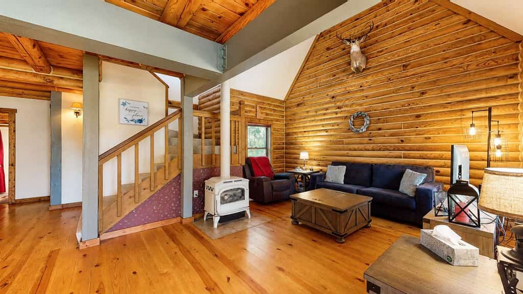 A rustic log cabin tucked into a quiet wooded setting near McCall and Brundage Mountain. Vaulted ceilings, a spacious loft living area, and a large deck with outdoor seating create an easy place to relax after a day exploring the mountains. Features include a fireplace (propane), flatscreen TVs, forest views, and flexible sleeping space for families and groups.