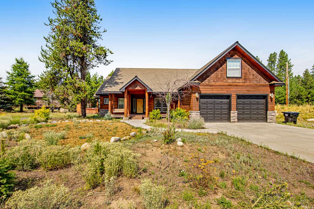 Spacious, pet-friendly McCall cabin with vaulted ceilings, multiple gathering spaces, a private hot tub, central A/C, and a large wraparound deck designed for outdoor living. Featuring a game room with foosball and darts, a bunk room loft for kids or groups, stainless steel appliances, and a private primary suite with soaking tub and deck access. Conveniently located for enjoying everything McCall has to offer year-round.