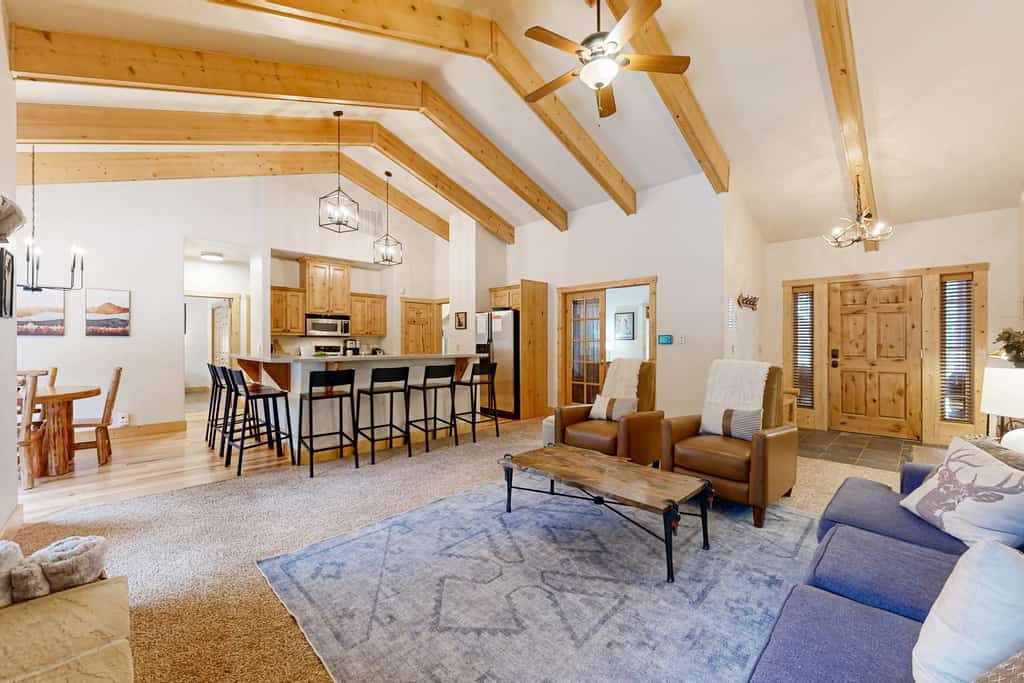 Spacious, pet-friendly McCall cabin with vaulted ceilings, multiple gathering spaces, a private hot tub, central A/C, and a large wraparound deck designed for outdoor living. Featuring a game room with foosball and darts, a bunk room loft for kids or groups, stainless steel appliances, and a private primary suite with soaking tub and deck access. Conveniently located for enjoying everything McCall has to offer year-round.