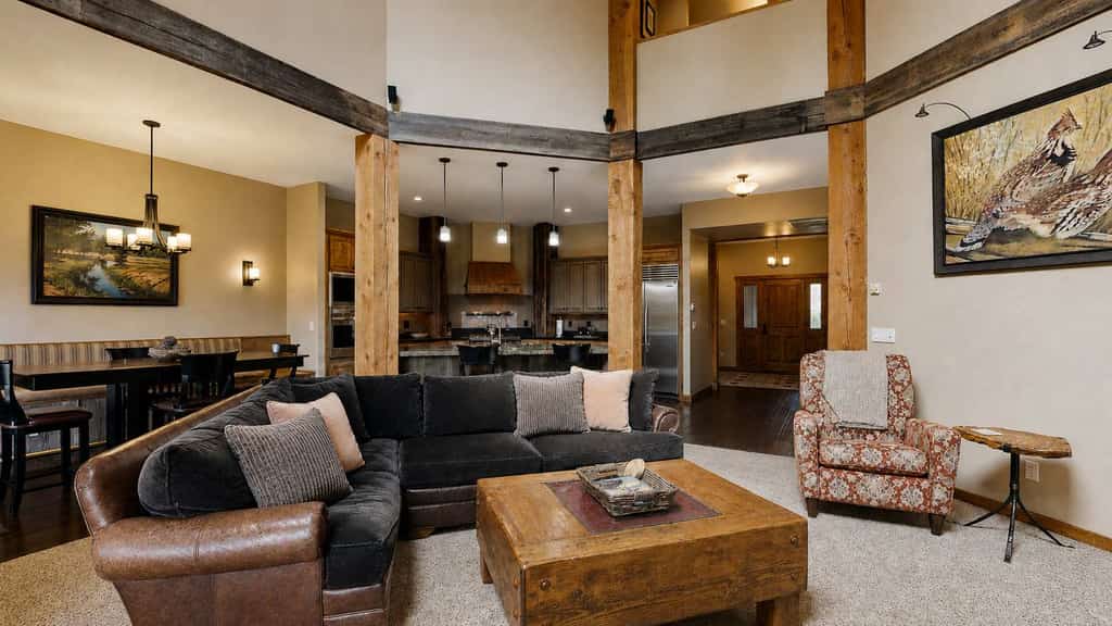 Luxury 3-bedroom townhome just outside McCall features high-end finishes, two king suites, and multiple living spaces. The covered back patio includes a fully equipped outdoor kitchen, dining area, and fireplace in a quiet, wooded setting that extends toward the Payette River. Inside, enjoy a Wolf range, stainless steel appliances, and multiple lounge areas, including an upstairs TV room.