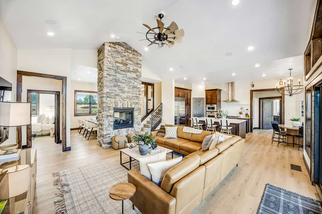 A spacious, newly built McCall home with mountain views, a private hot tub, and an upstairs game room designed for families and groups. Four bedrooms, multiple living spaces, a covered patio, and a dual-sided stone fireplace create an easy place to gather and relax. Located near Lake Fork and just a short drive from downtown McCall, Payette Lake, and year-round recreation.