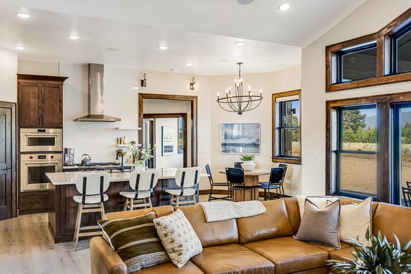 A spacious, newly built McCall home with mountain views, a private hot tub, and an upstairs game room designed for families and groups. Four bedrooms, multiple living spaces, a covered patio, and a dual-sided stone fireplace create an easy place to gather and relax. Located near Lake Fork and just a short drive from downtown McCall, Payette Lake, and year-round recreation.